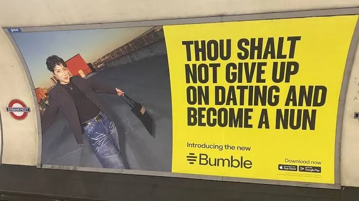 Bumble poster in a London Underground station reading “Thou shalt not give up on dating and become a nun”
